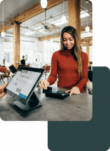 Woman who is paying for her goods at the Point Of Sale Terminal